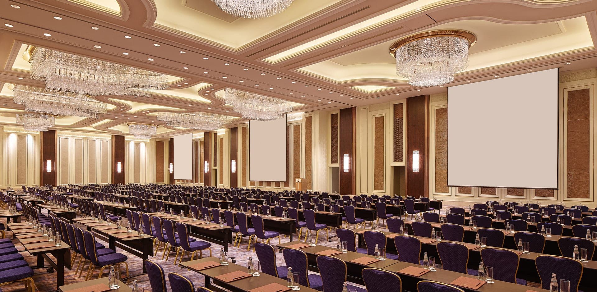 Hosts preparing a ballroom for an evening event